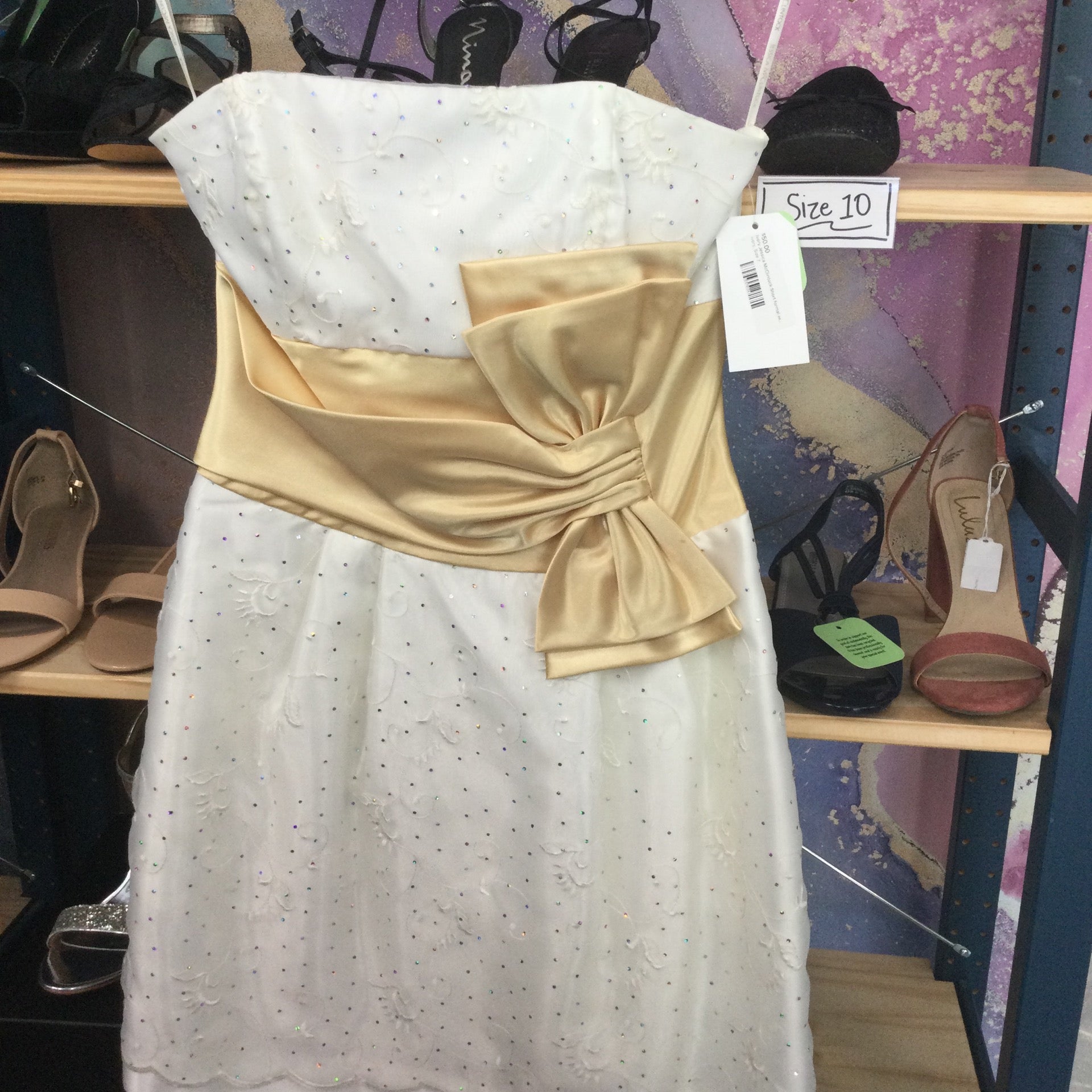 Ivory Jessica McClintock Short formal with gold "belt" bow around waist.  Sleeveless with embroidery and rainbow sparkles size 7 | ReWed Bridal